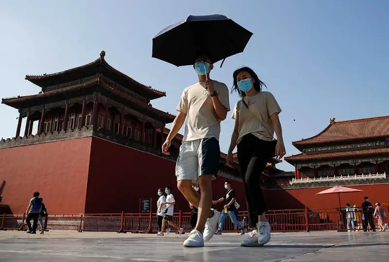 COVID-19: Хитой карантин режимини енгиллаштирди