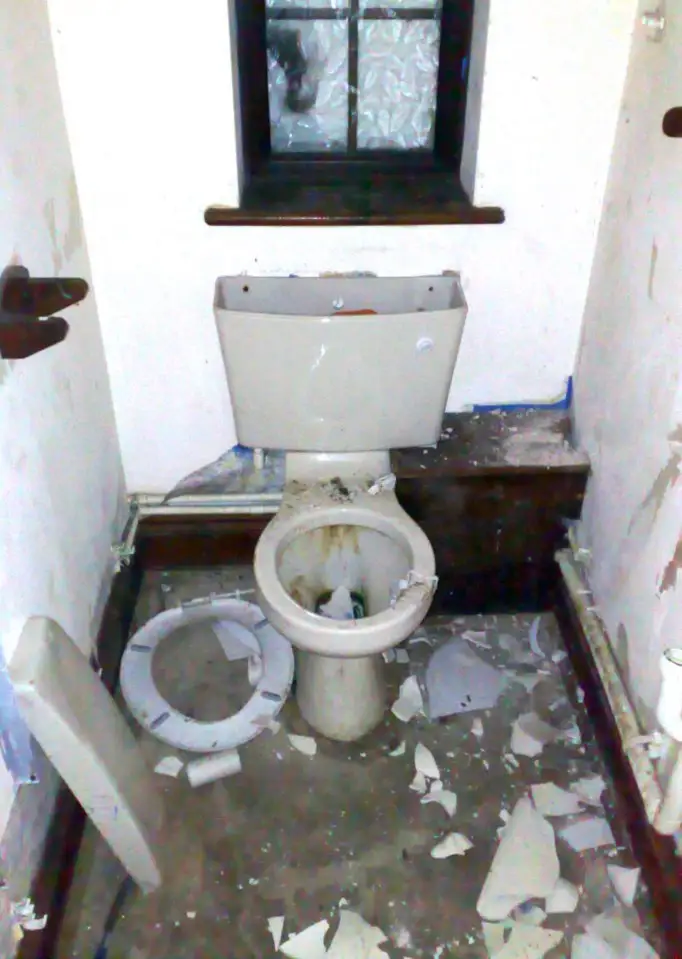 The downstairs toilet in the abandoned and derelict mansion of &pound;9.4m lottery lout Michael Carroll. The house set in vast grounds is in a terrible state with every window smashed and every room trashed with litter left in great piles.