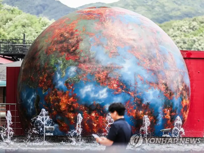 This file photo shows a sculpture depicting a burning Earth in Daegu, some 237 kilometers southeast of Seoul.