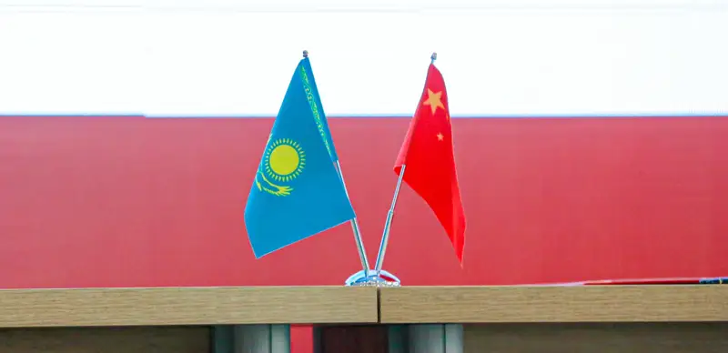 Flags of Kazakhstan and China.