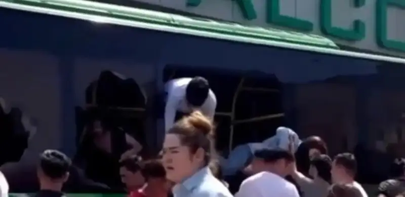 1 killed and 16 injured as bus rams into store in Almaty