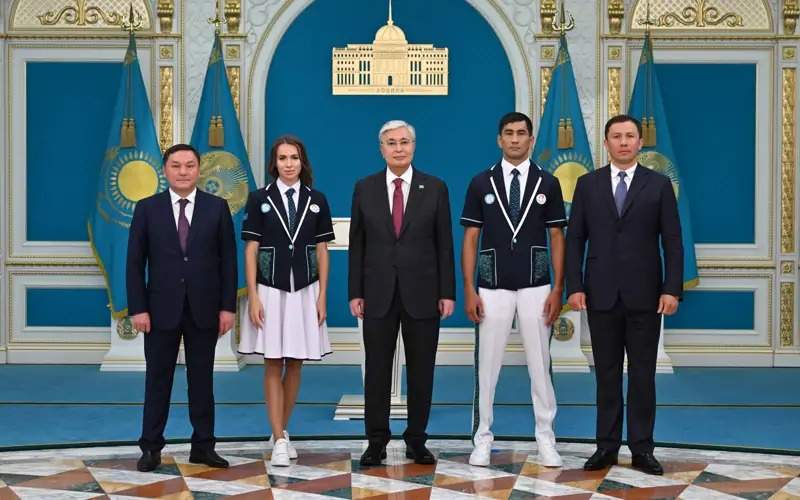 President Tokayev hands in state flag to 2024 Olympic Games participants President Tokayev hands in state flag to 2024 Olympic Games participants
