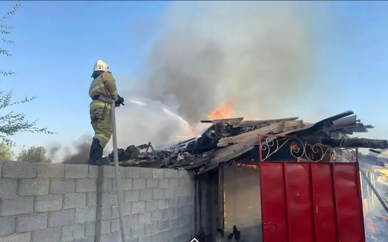 A firefighter battles the fire
