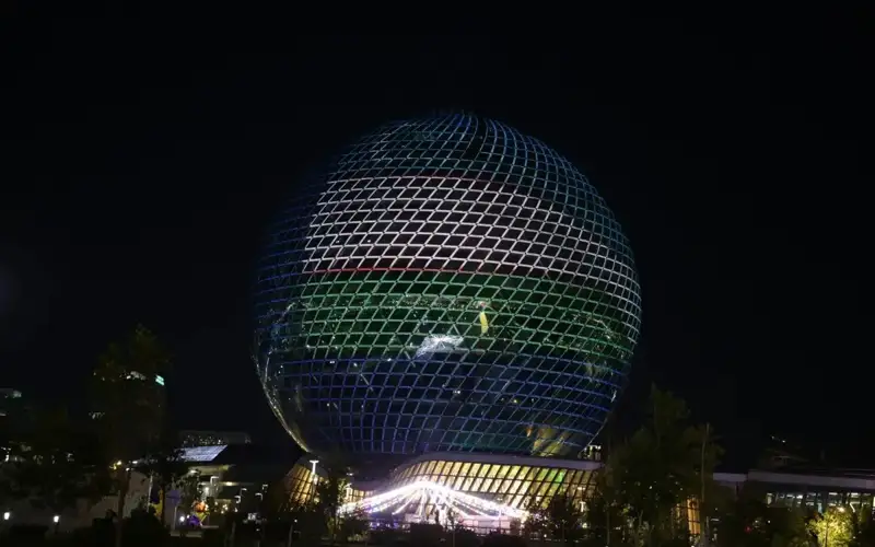 Nur Alem Sphere in Astana lit up in colors of Kazakhstan, Uzbekistan flags