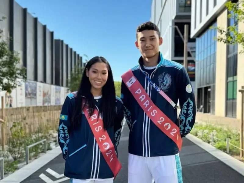 Знаменосцы сборной Казахстана на церемонии закрытия Олимпиады — Эльжана Таниева и Батырхан Толеугали