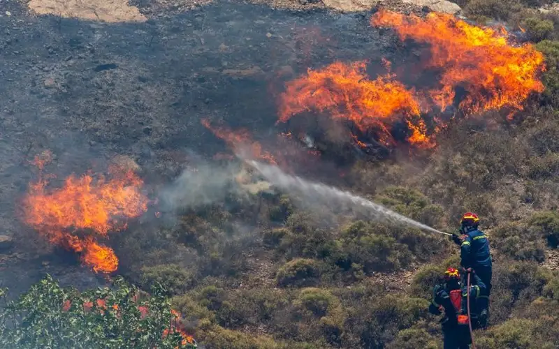 Wildfires near Athens force evacuation amid intense heat, strong wind