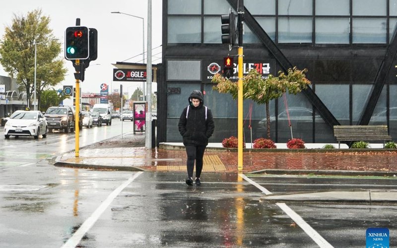 A pedestrian walks on a street in Christchurch, New Zealand, May 1, 2025. Severe weather has hit New Zealand on Thursday with a State of Emergency declared in part of the country. A pedestrian walks on a street in Christchurch, New Zealand, May 1, 2025. Severe weather has hit New Zealand on Thursday with a State of Emergency declared in part of the country.