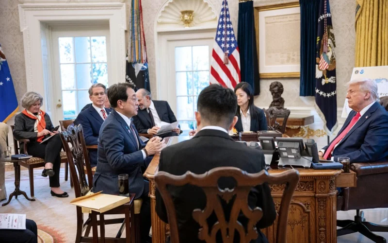 Photo taken from the Cabinet Secretariat's website shows Japanese economic revitalization minister Ryosei Akazawa (front L) holding talks with U.S. President Donald Trump (far R) in Washington on April 16, 2025.