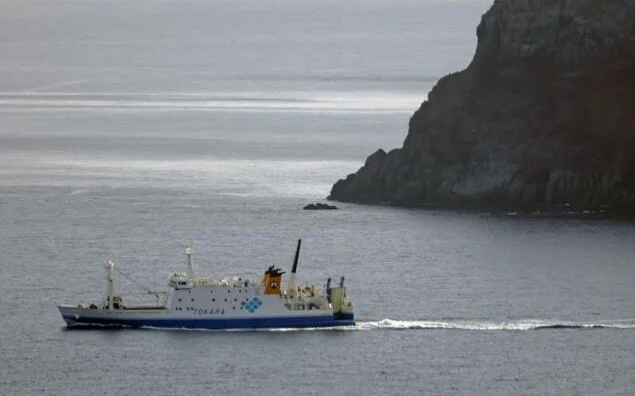 Photo taken from a Kyodo News plane on the morning of July 4, 2025, shows a ferry carrying evacuees from Akuseki Island, part of the Tokara island chain in Kagoshima Prefecture.