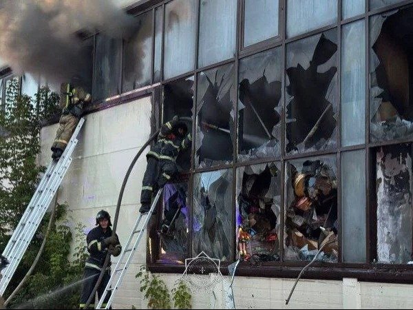 fire Firefighters battle large fire at market building in Astana