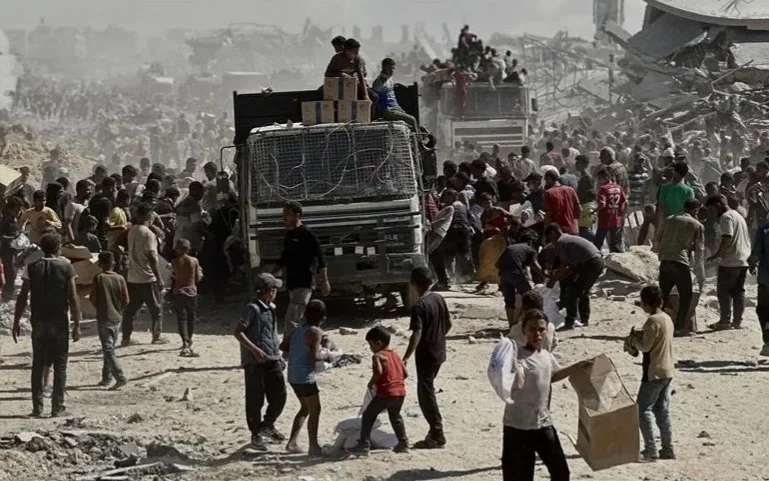 Aid trucks begin entering Gaza under ceasefire agreement