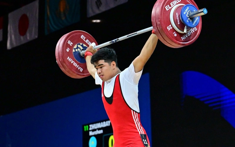 Weightlifter Nurzhan Zhumabay earns gold and silver in Manama