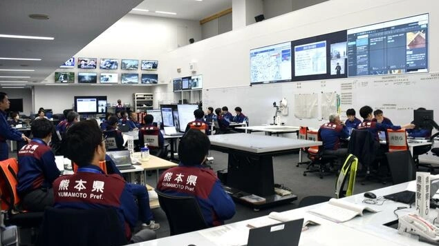 Officials work at a disaster response headquarters set up at the Kumamoto prefectural government office in Kumamoto after an earthquake hit the southwestern Japan prefecture on Nov. 25, 2025. (Kyodo)