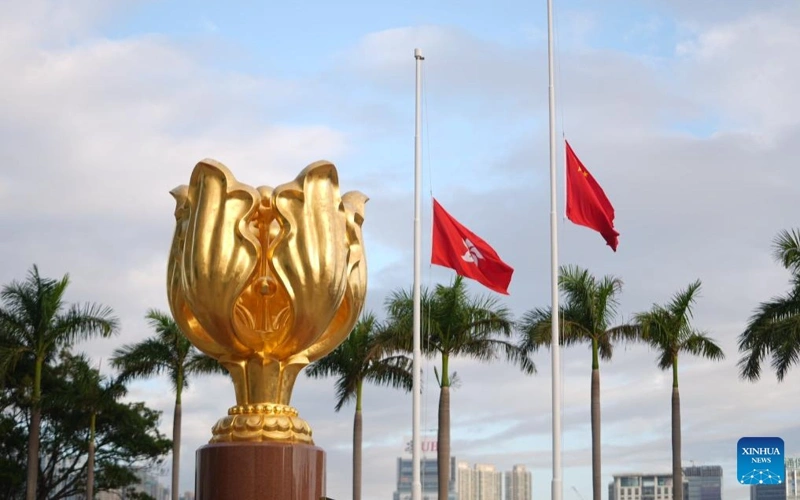 Hong Kong mourns fire victims with flags at half-mast