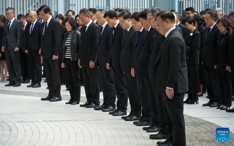 Hong Kong mourns fire victims with flags at half-mast