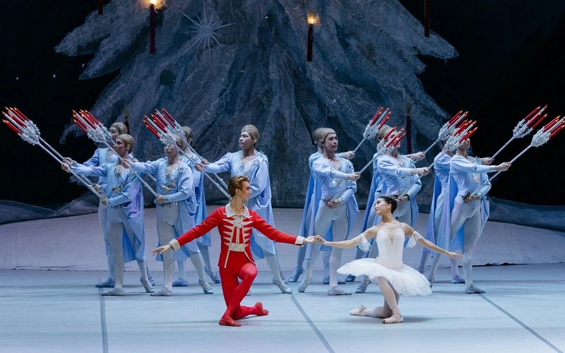 The New Year’s Fairy Tale Returns Home The countdown to the New Year traditionally belongs to The Nutcracker on the Astana Opera stage. This season is particularly special. After two years of successful tours in Dubai, where the Kazakh ballet company captivated international audiences, the magical fairy tale set to Tchaikovsky’s music is finally returning to its cherished home audience. From December 17 to 31, spectators are invited to meet the timeless masterpiece staged by one of the greatest contemporary choreographers, Yuri Grigorovich.  The billboards for this performance are dotted with the names of ballet stars of first magnitude. Special attention is drawn to two evenings, December 19 and 20, when the leading roles will be performed by a guest soloist from the Bolshoi Theatre, principal dancer Margarita Shrainer, and the Astana Opera’s principal dancer Bakhtiyar Adamzhan. For Ms. Shrainer, who trained under famous teachers, this is one of her most significant roles.  “Yuri Grigorovich’s choreography is an entire philosophy. It is brilliant in its complex simplicity. From the outside, the movements may seem fluid, even restrained. However, within this restraint lies all the difficulty. Not a single superfluous gesture; every line must be precise, like a diamond edge. The adagio with the Prince in Confiturenburg is especially mesmerizing... Balance, trust in your partner, absolute concentration. It is incredibly difficult to execute this so the audience does not see the labour, but only the flight of the soul,” shares Margarita Shrainer. “My heroine isn’t playing with dolls; she genuinely believes in this world. The transformation begins the moment the Nutcracker comes to life. And here, the dance changes. More fluidity and spirituality appear; the gaze seeks not a toy, but a personality. In Confiturenburg, Marie is already a young woman discovering her first, most tender love. It is wonder, delight, and a bright sadness from the realization that the world is vast and beautiful. The hardest part is to convey this subtle line so that the audience believes that the character before them is the same heroine who lived one night equal to an entire life,” concludes Margarita Shrainer.  However, dancers who will be debuting will also capture the public’s attention. They were prepared for the stage by the artistic director of the ballet company and world ballet star, Altynai Asylmuratova. This year, the morning performances will provide an opportunity for young talents to shine: Alina Zyryanova and Akbar Iminov will perform the main roles for the first time. Throughout all the December days, the roles of the Prince and Marie will also be brilliantly performed by audience favourites: Madina Unerbayeva, Aigerim Beketayeva, Yerkin Rakhmatullayev, Shugyla Adepkhan, Dias Kurmangazy, Sofiya Adilkhanova, Erkin Bazarbaev, and many others.Conductors Arman Urazgaliyev and Yerbolat Akhmedyarov will lead the Astana Opera Symphony Orchestra on different days.   An integral part of this ballet’s success is the design by People’s Artist of the USSR Simon Virsaladze. They say he ‘dressed the dance’. Indeed, his costume and set designs are a work of art in itself. Nearly 200 vibrant costumes with a rich colour palette, as well as fairy-tale props – ships, cannons, lambs – give the audience a feeling of a genuine miracle. This very version of The Nutcracker has been running at the Astana Opera with unwavering success as part of the company’s repertoire for 11 years. For the residents and guests of the capital, attending The Nutcracker at the Astana Opera has already become a wonderful tradition preceding the holiday. As many of them note: “It is a beautiful start to the most magical time of the year.”  Furthermore, the opera house has prepared a surprise for its young spectators. In addition to the ballet, an interactive holiday event, New Year’s Symphony of Wonders, will take place in the Astana Opera foyer from December 18 to 29. Children will enjoy a fascinating adventure in the New Year’s Art Library, where they will meet Lady Lumière, the Clockmaker, and the mysterious Impresario. The young theatre-goers will get to become the main characters, save the magic from the Darkness, light up the Christmas tree, and restore harmony.