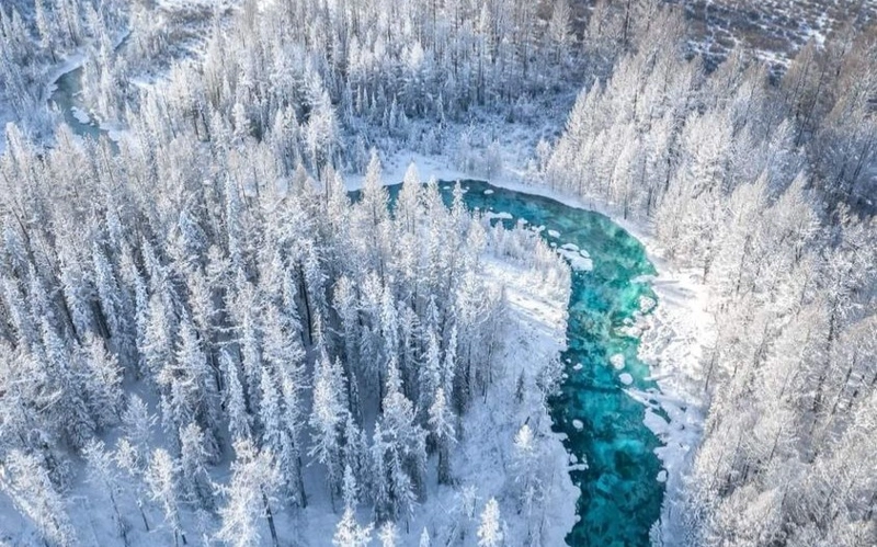 Never-freezing river in Mongolia in its winter splendor