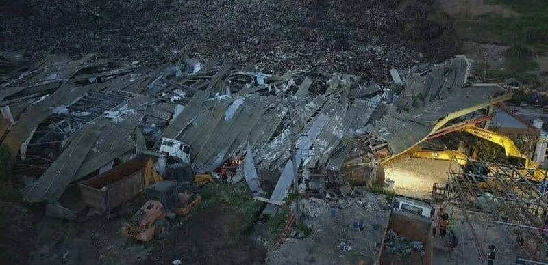 Search continues for dozens feared trapped after landfill collapse in central Philippines