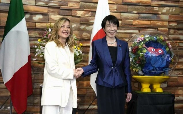 Italian Prime Minister Giorgia Meloni (L) and Japanese Prime Minister Sanae Takaichi shake hands ahead of their talks in Tokyo on Jan. 16, 2026. 