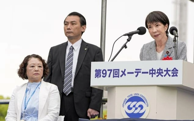 Japan PM pledges sustained pay hikes at May Day event