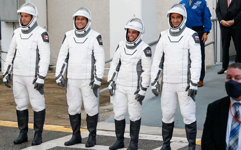 Four astronauts reach ISS in record time