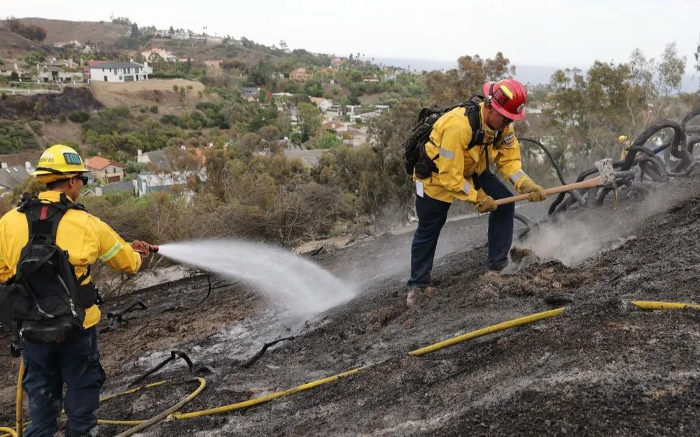 More than 90,000 without power as wildfires spread in Southern California