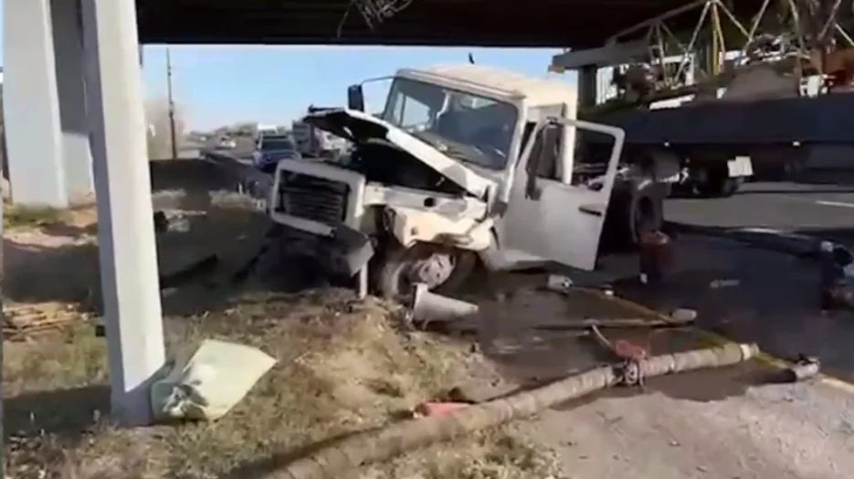 Sewage truck falls off bridge after collision with Tesla in Astana